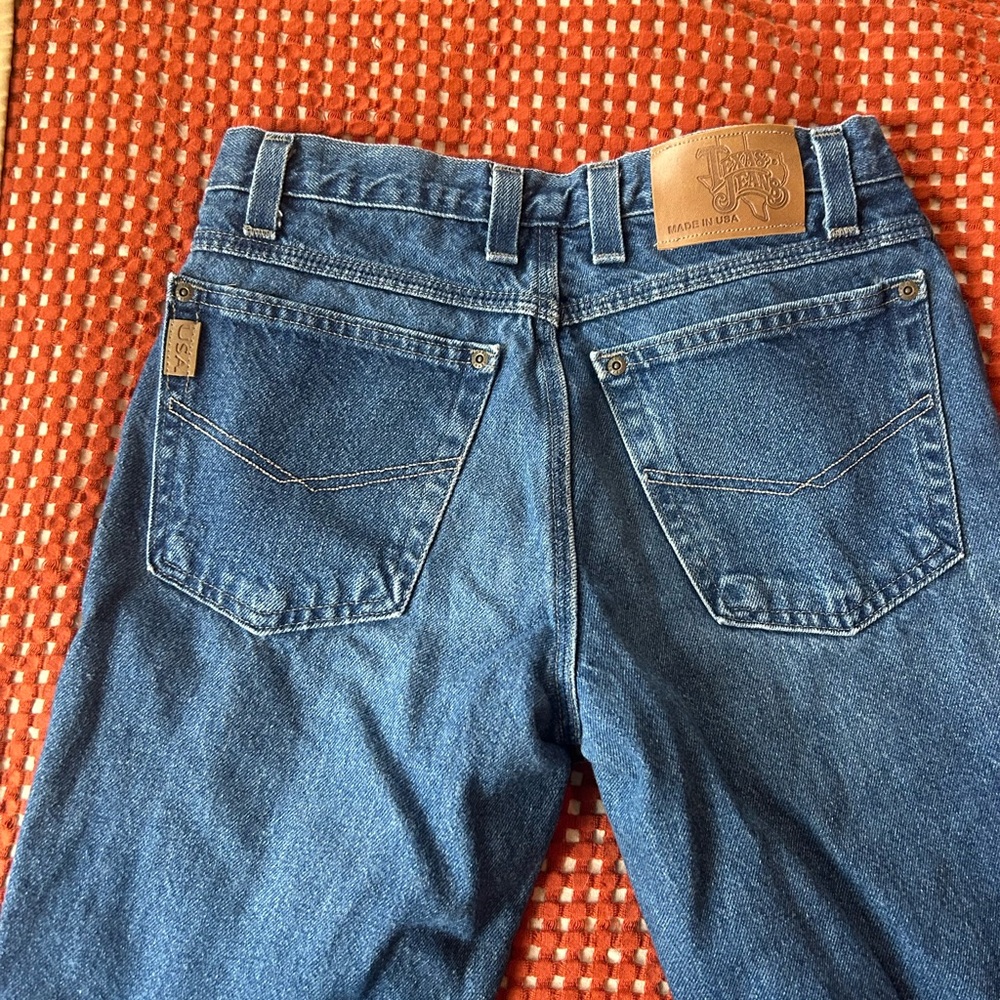 100% cotton made in the USA classic blue jeans with cut off hem